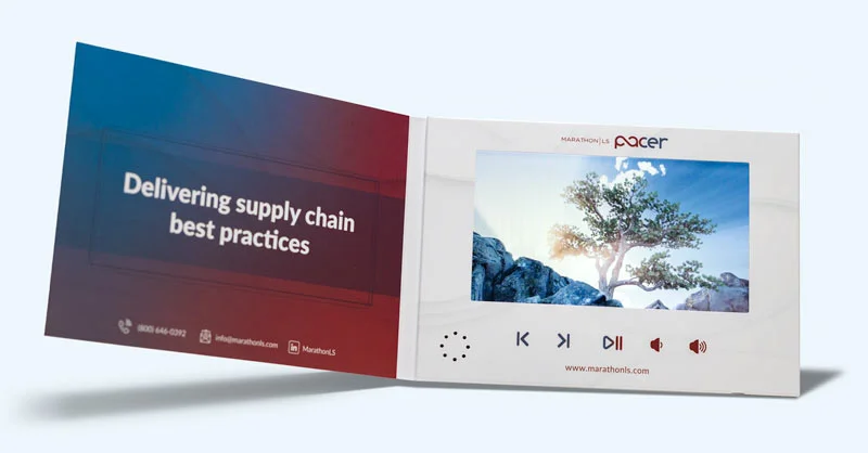 Softcover printed video brochure with built-in screen playing a video