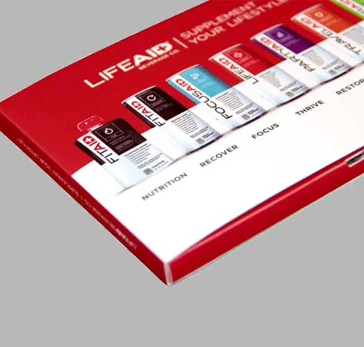 Printed video device showing playback controls beside its cover